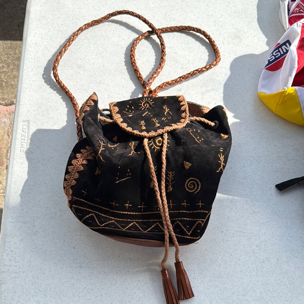 Black And Brown Backpack With Drawstring Closure - image 1